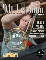cover of mt lebanon magazine with man blowing glass at an art center